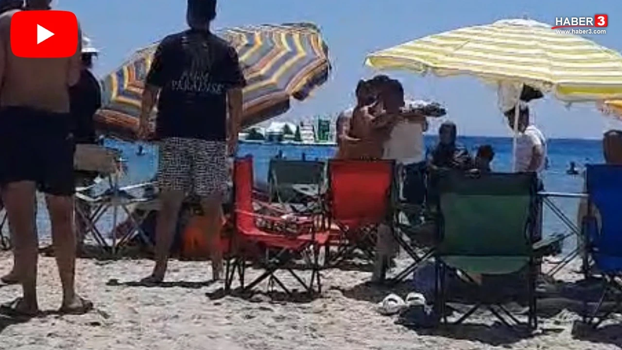 Plajda tatilcilerle işletme sahipleri arasında ''şemsiye açamazsın'' kavgası