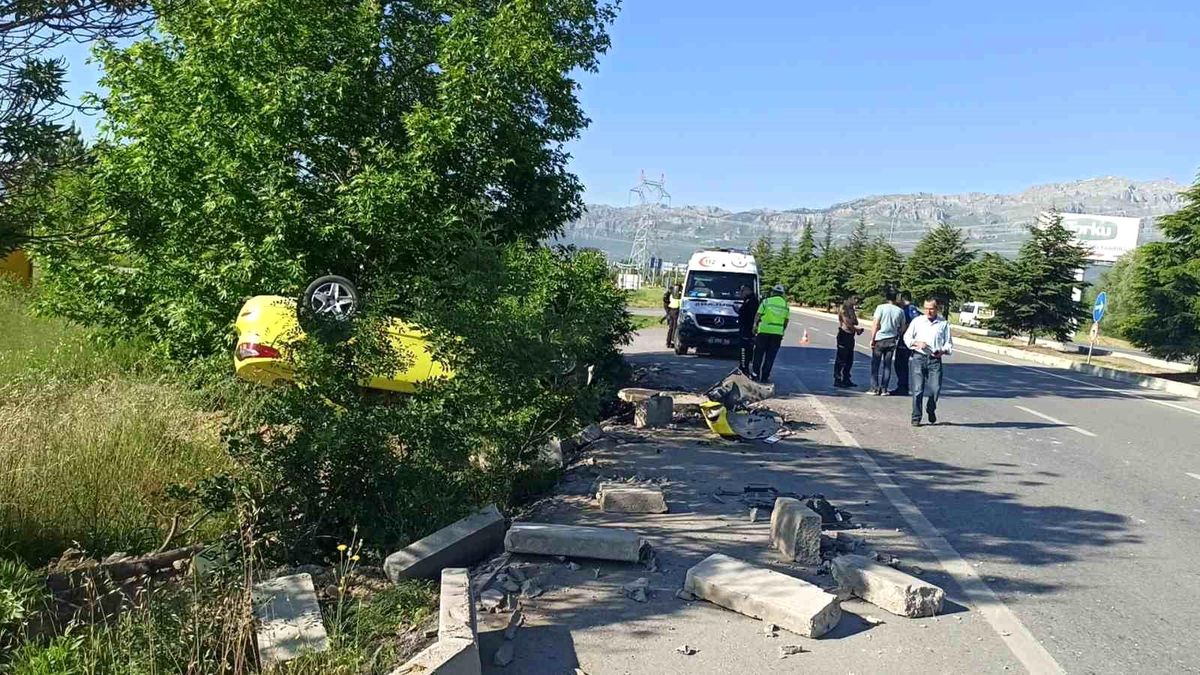 Takla atan otomobilden sürücü yaralı kurtuldu