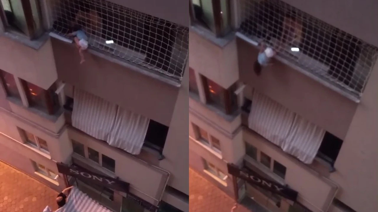 Balkon filesinde asılı kalan çocuğunu düşmesin diye dakikalarca tuttu