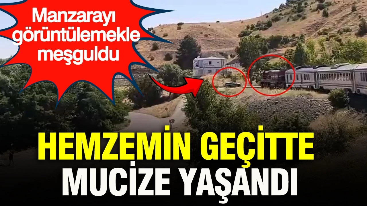 Hemzemin geçitte mucize yaşandı: Manzarayı görüntülemekle meşguldü